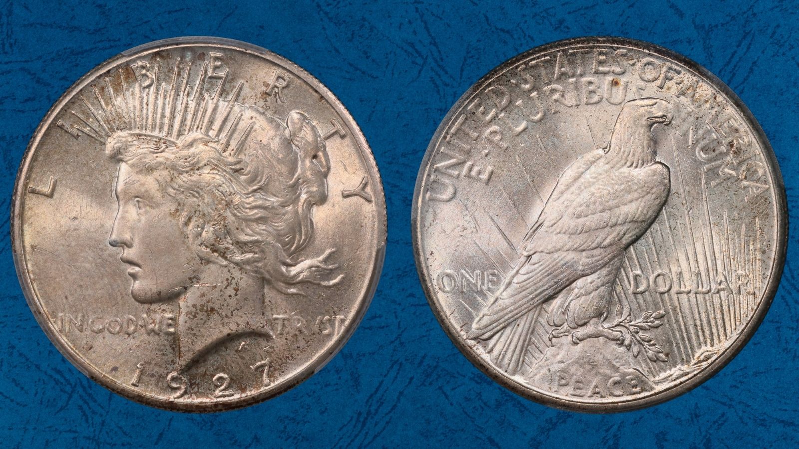 Comparison of standard 1927 Peace Dollar motto vs VAM 2 Doubled Motto variety showing doubling under magnification